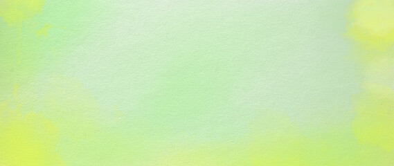 Pastel faded green and yellow hand painted watercolor background design with paint bleed fringing in pretty art design on watercolor paper texture, soft fresh spring color background with no people