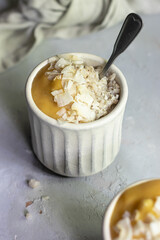 Coconut oatmeal with mango puree 