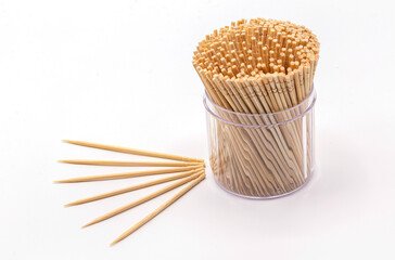 Close up wooden toothpicks in a box isolate on white background.