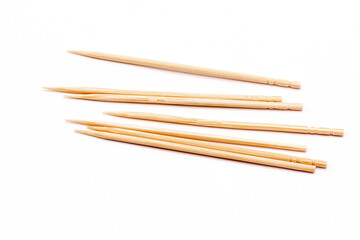 Close up wooden toothpicks in a box isolate on white background.