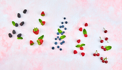 Blueberry, raspberry, blackberry, strawberry, cherry. Fresh blueberry, berries mix on pink marble. Red raspberry, mint creative composition. Colorful trendy concept, top view.