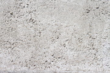 Concrete with rocks wall bumpy surface cool urban grungy wallpaper macro