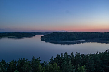 Peaceful night scene with the starry sky at a lake in Lithuania.