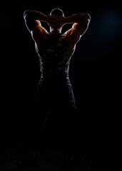 Portrait of strong handsome man on black- studio shot © qunica.com