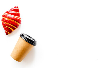 Croissants with coffee - breakfast on white table top view