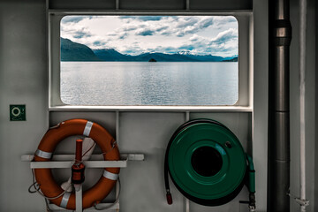 lifebuoy and window at ferryboat