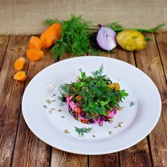 Beetroot, potato and carrot salad with greens