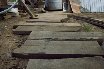 Fototapeta na wymiar a pathway of wooden boards