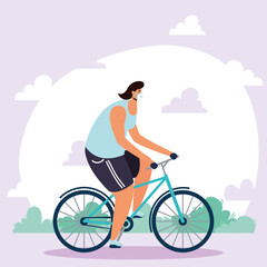 Naklejka premium young man wearing medical mask in bicycle