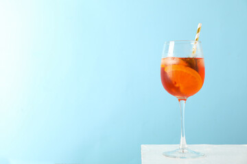 Composition with aperol spritz cocktail on color background. Summer drink
