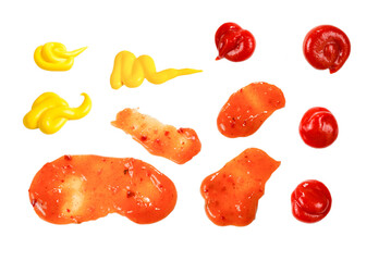 Orange spicy sauce splashes isolated on white background.