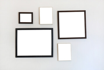 Frame of empty image on white wall background.