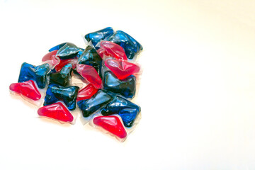 gel capsules for delicate washing. Red and blue liquid powder capsules