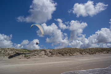 Paraglider on the Nida dune, in front of the Baltic sea