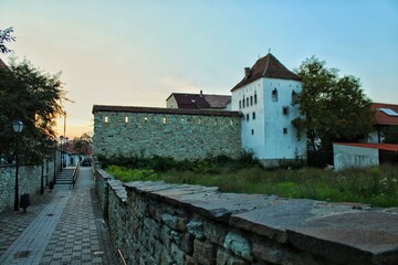Medieval citadel with a sunset behind in a summer evening