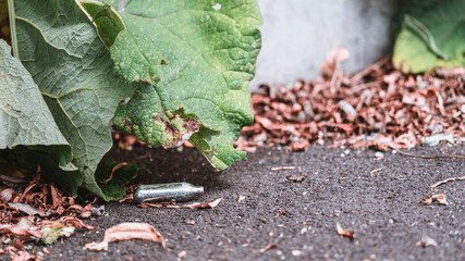 Discarded Nitrous Oxide capsule in gutter