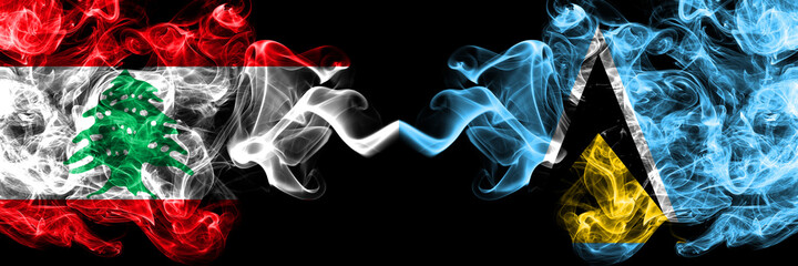 Lebanon vs Saint Lucia smoky mystic flags placed side by side. Thick colored silky abstract smoke flags.