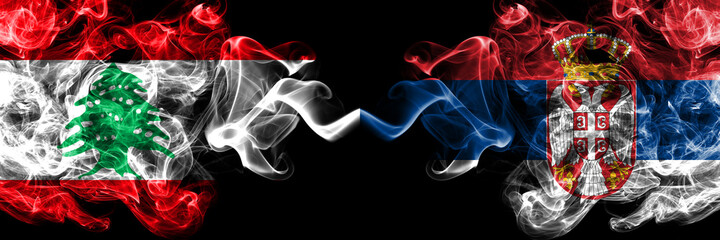 Lebanon vs Serbia, Serbian smoky mystic flags placed side by side. Thick colored silky abstract smoke flags.