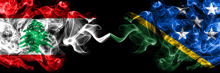 Lebanon vs Solomon Islands smoky mystic flags placed side by side. Thick colored silky abstract smoke flags.