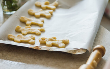 Making of gingerbread man on the kitchen. Selective focus.