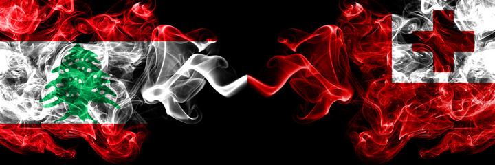 Lebanon vs Tonga, Tongan smoky mystic flags placed side by side. Thick colored silky abstract smoke flags.