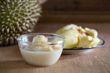Durian with coconut milk and sticky rice in glass bowl, Popular thai dessert