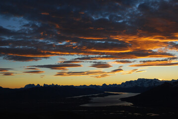 Dramatic sky cluds. Orange lenticular cluds. Sunset. South Patagonian sky.