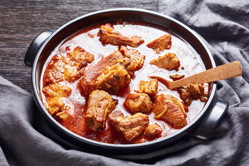 braised pork brisket chunks in a pan