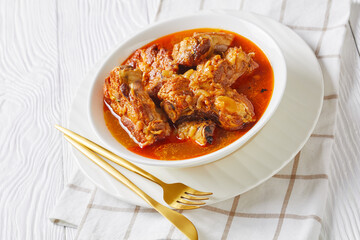Braised Pork pieces in a white bowl