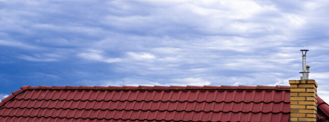 Roof against the cloudy sky.