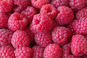 Tasty raspberry at a farmers market background