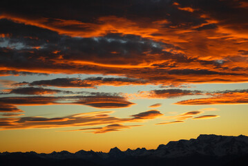 Fototapeta premium Dramatic sky cluds. Orange lenticular cluds. Sunset. South Patagonian sky.