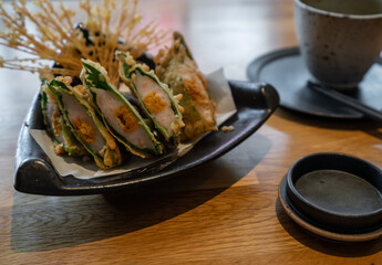 Delicious tempura and tea are on the table
