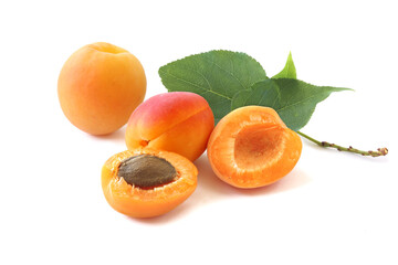 Delicious whole apricots with two halves isolated on white