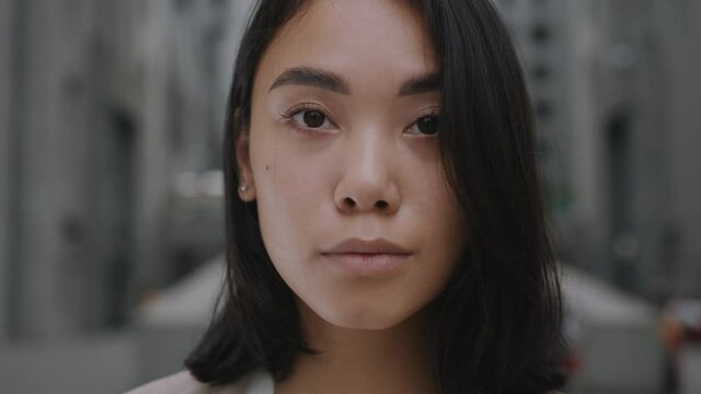 Close-up portrait of nice-looking asian multi-race beautiful businessperson elegant young woman looking into camera. Career people. Fashion, beauty. Female portraits.