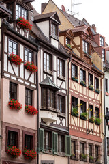 Obraz premium Detail of Half-timber work on the facades of wooden buildings in the German city of Nuremberg, Bavaria. Vertical detail