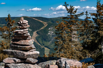 Rock balancing in Sudetes mountains landscape