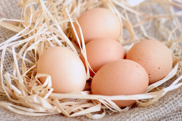 Eggs over jute sack background. Happy easter.