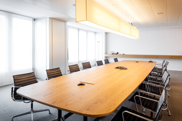 Modern and comfortable empty meeting room of overseas corporation, equipped with contemporary furniture and latest communications technology
