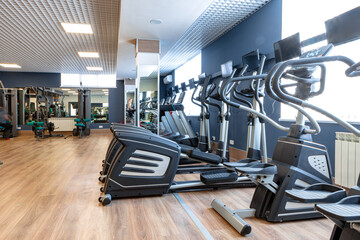 Fototapeta na wymiar Sports apparatus for cardio training in a gym