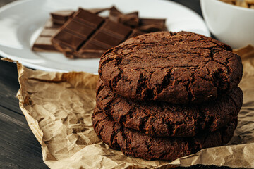 Chocolate cookies on dark table close up