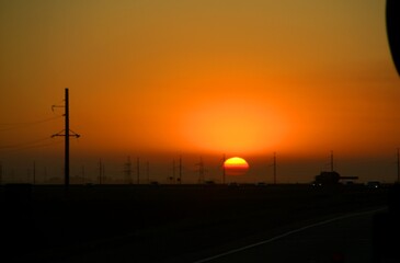 Fototapeta na wymiar Southern sunset on the highway in the Krasnodar territory