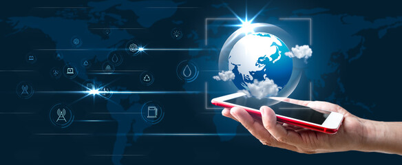 Sustainable development and Ecology concept. Planet Earth with icons energy sources showing up on smart phone for renewable. Abstract science Panoramic banner with copy space
