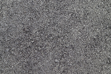Black asphalt surface. Black rough texture background.