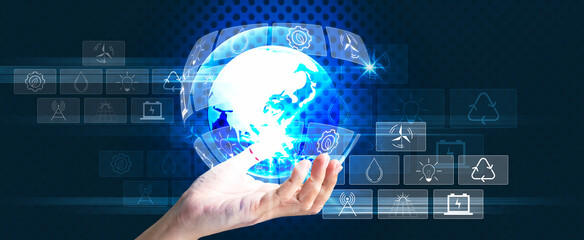 Holding global on human hand with icons energy sources for renewable. Sustainable development Panoramic banner with copy space