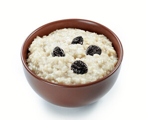 oatmeal  with prunes in ceramic bowl isolated white background