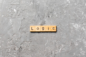 Logic word written on wood block. Logic text on table, concept
