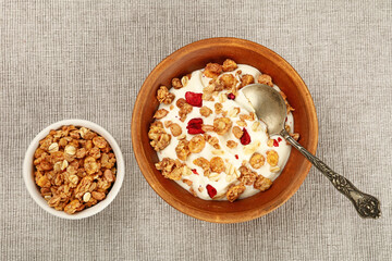 Portion of muesli granola breakfast with yogurt