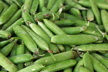 Close up green peas pods on retail display