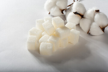 Refined sugar on a white background. Pyramid of sugar.